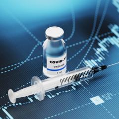 COVID vaccine and syringe 