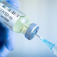 COVID vaccine and syringe 